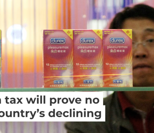 A Chinese visitor looks at condoms at the Beijing International Sex Supplies Exhibition. Zhang Peng/LightRocket via Getty Images